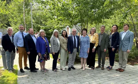 A group of Maine biomedical researchers poses with Sen. Susan Collins